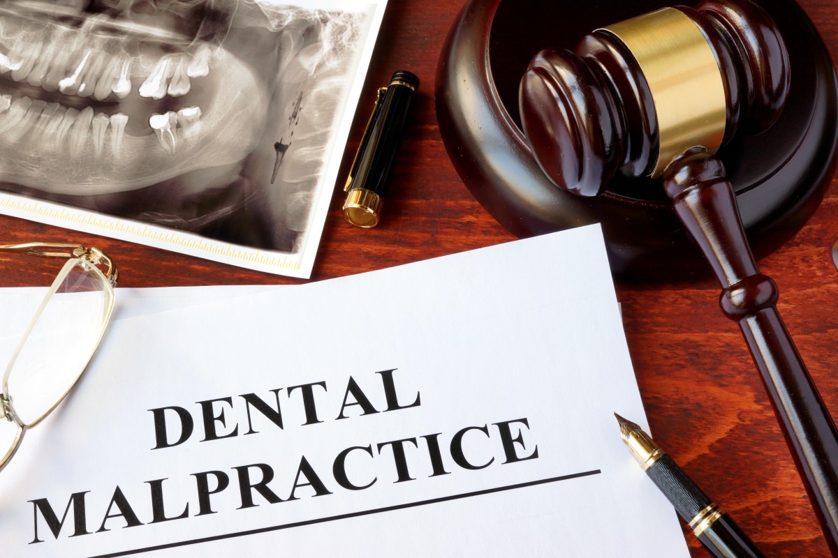Dental malpractice form with gavel and xray 132214535
