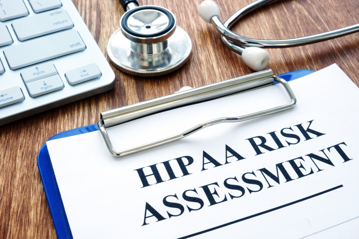 clipboard with paper reading HIPAA Risk Assessment243168932