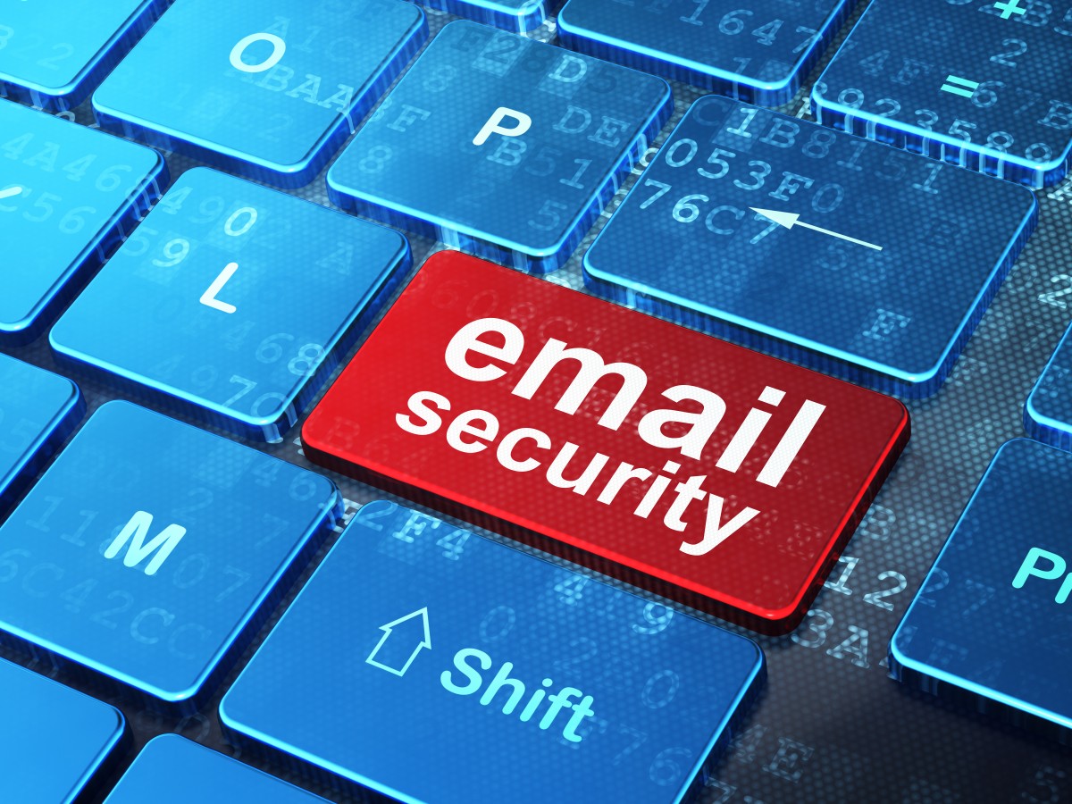 Red button on keyboard reads "email security"58329405