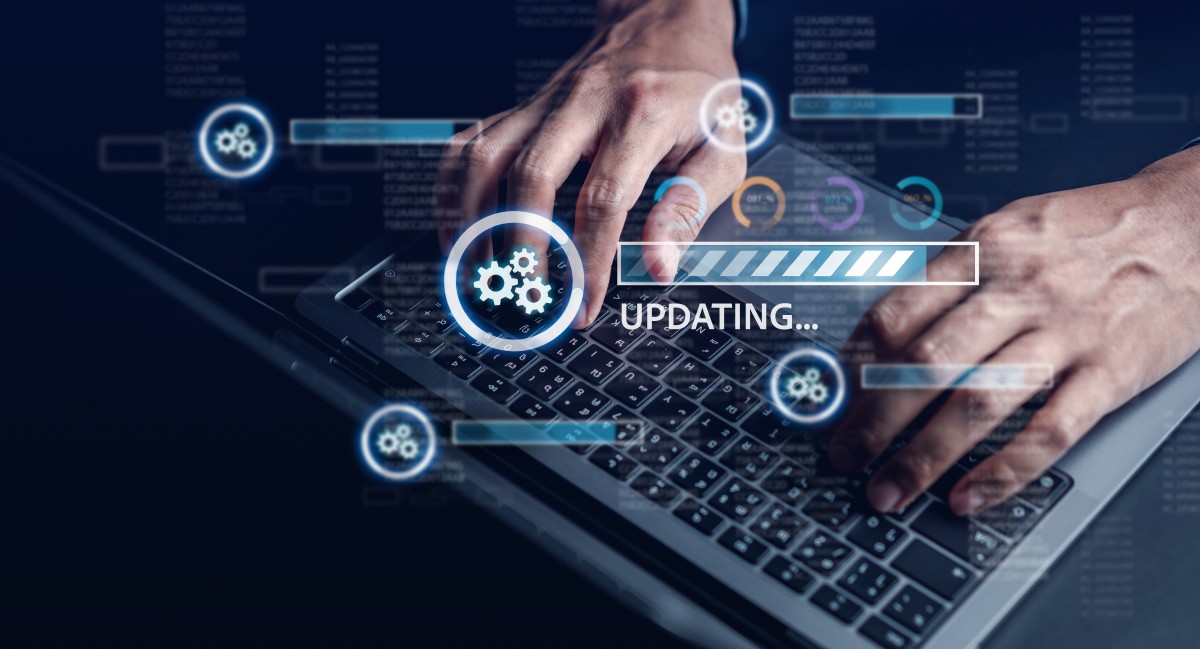 hands on keyboard and overlay of security patches installing 629038997