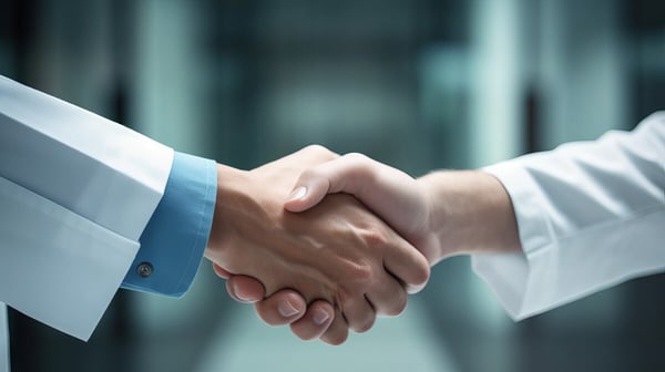 doctor shaking hands with person in suit 661388588